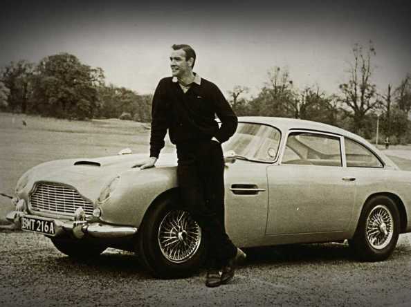 Sean Connery and the first appearance of the DB5 in “Goldfinger”. Image source: BusinessInsider.com