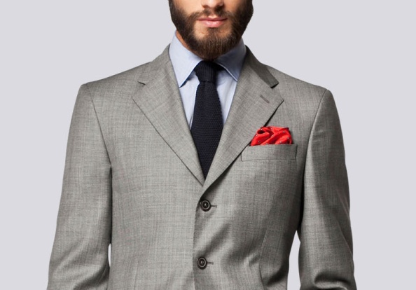 Although the details like pick stitching are incredibly subtle here, the subtlety of the accents as opposed to the navy blazer previously, sets the tone of dressing between serious debonair and playful. While it might be harder to wear the navy DB to a corporate office, this grey suit from Carolina Herrera fits in beautifully.