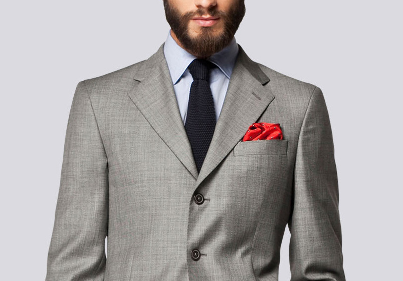 Although the details like pick stitching are incredibly subtle here, the subtlety of the accents as opposed to the navy blazer previously, sets the tone of dressing between serious debonair and playful. While it might be harder to wear the navy DB to a corporate office, this grey suit from Carolina Herrera fits in beautifully.