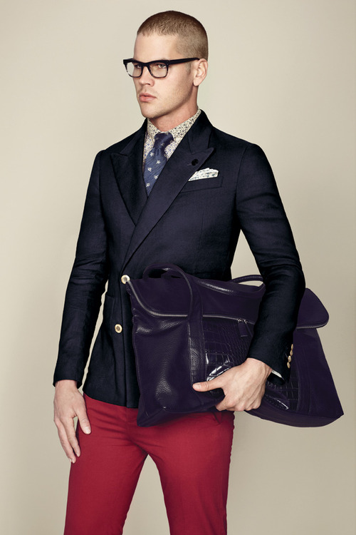 While the double breasted blazer is a weapon for sartorial formality, when paired with red trousers- it becomes dressed down. The navy patterned necktie lends the smart to smart casual. I wouldn't wear this to the office unless I worked in advertising or publishing.