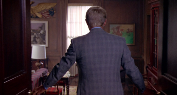 Note the waist suppression on his jacket. Buttoned up, McQueen cuts an impressive figure. Structured shoulders- a hallmark of British tailoring.
