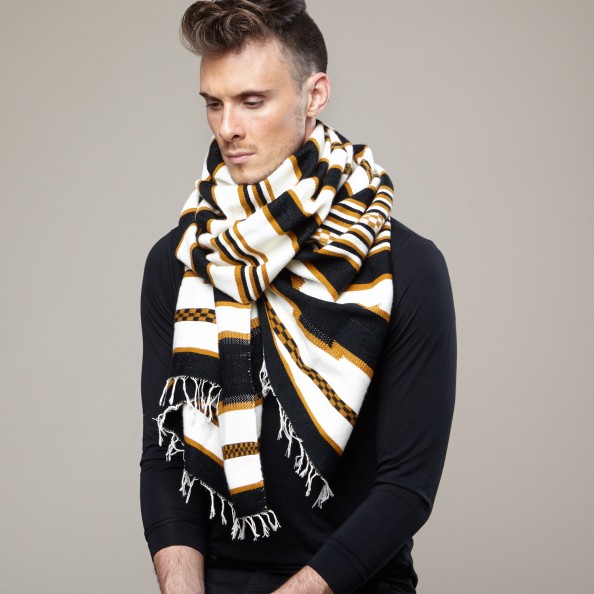 Simple yet striking, this scarf was hand-woven by the Dorze tribe near Arba Minch in southern Ethiopia. The Dorze were once feared warriors but are now known for being the finest weavers in Ethiopia. This soft scarf is tightly woven from a mix of cotton and acrylic fibers.